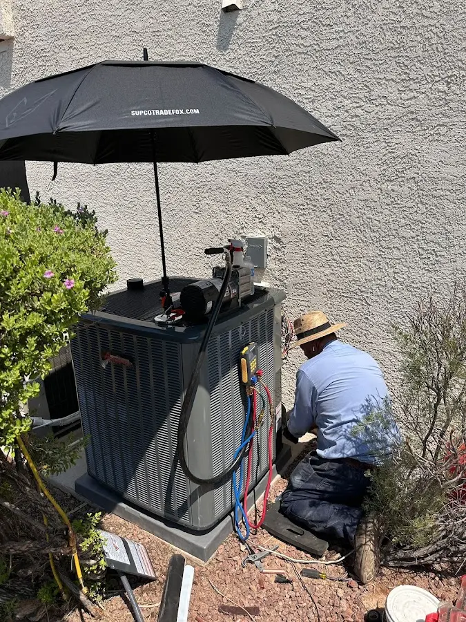 HVAC technician performing outdoor AC maintenance in Mountain View